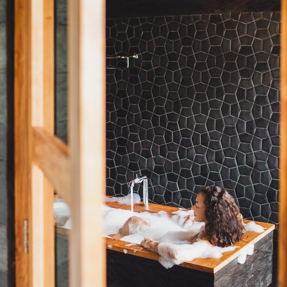 slim-beautiful-girl-enjoying-in-bath-full-of-foam-2023-11-27-05-09-04-utc